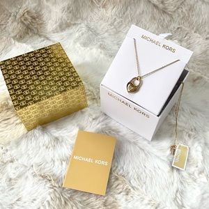 NWT authentic MK gold plated heart pendant